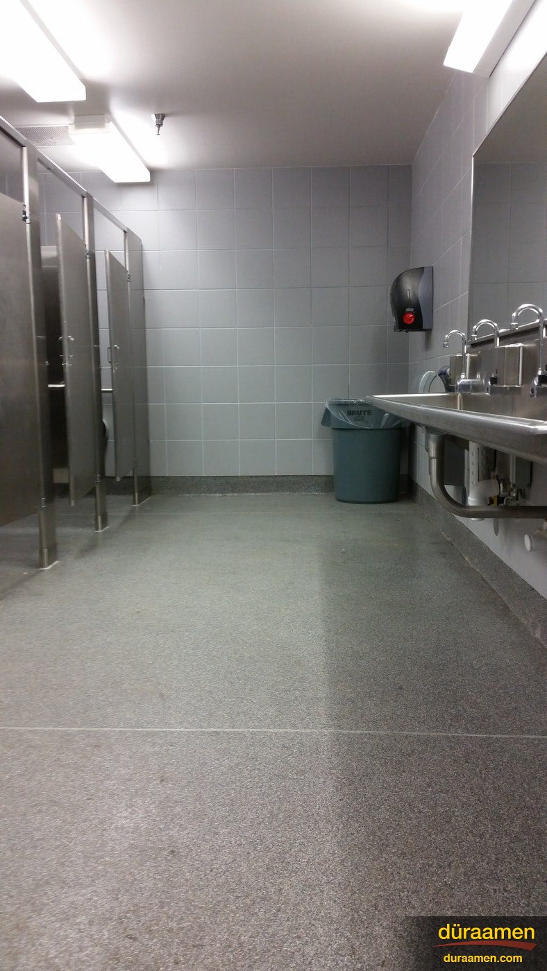 Kwortz flooring by Duraamen is and ideal solution where moisture is an issue such as a public restroom Quartz Flooring in a Commercial Restroom | Duraamen Engineered Products Inc