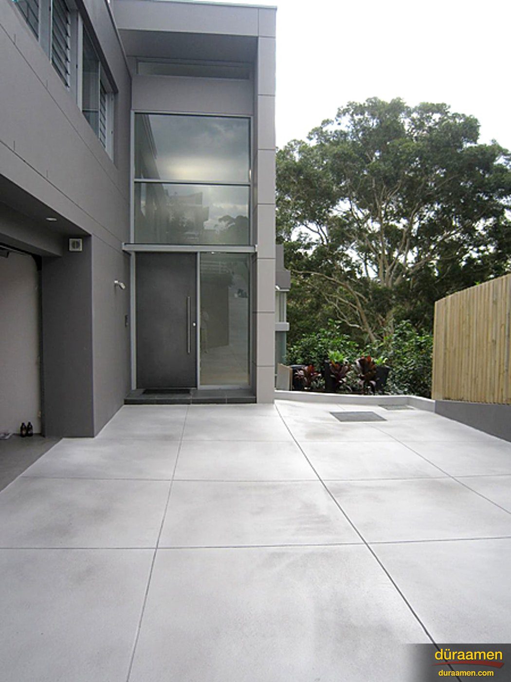 Driveways are perfect candidates for exterior concrete overlays Terrazzi Polished Concrete in Modern Residence Driveway | Duraamen Engineered Products Inc