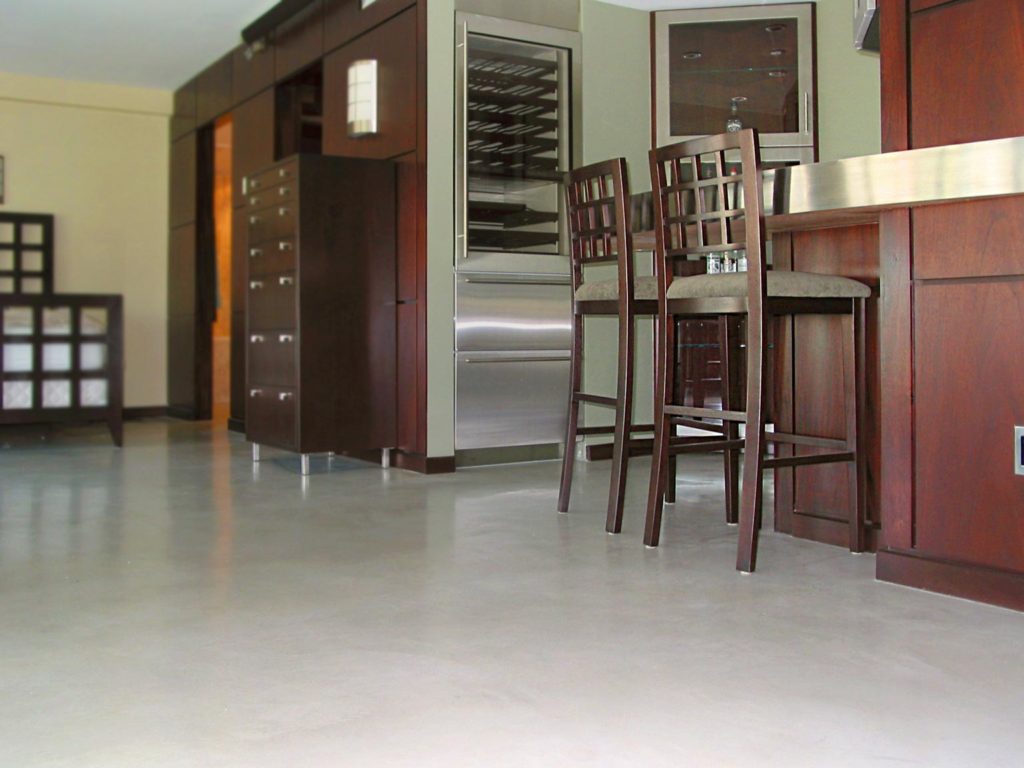 Residential kitchen with Skraffino micro topping floor system.