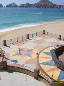 The view of the ocean and the decorative exterior concrete patio at this Mexican resort is spectacular.
