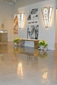 A detailed close-up of a polished concrete floor displaying a glossy finish, showcasing intricate patterns and textures in shades of gray.