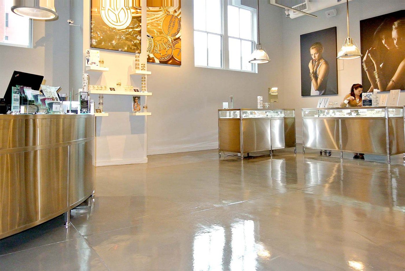 A detailed close up of a glossy polished concrete floor featuring intricate patterns in shades of gray and white The High end Jewelry Retailer Alex and Ani Gets a Polished Concrete Floor for Their Flagship Store | Duraamen Engineered Products Inc