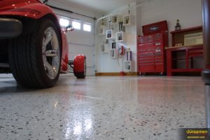 This hot rod garage has a high shine flooring thanks to Duraamen's epoxy resin chip system.