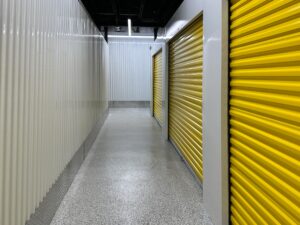 Duraamen's epoxy floor coating and resin chips with a polyaspartic topcoat used as the flooring in this self storage facility. Hallway photo 3.