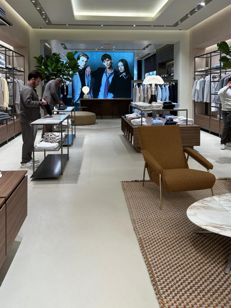 Terrazzi Sprayable Microcement system was installed in Boggi Milano men's retail clothier They used a custom color and the floor was sealed with Perdure A03 and Perdure U45.