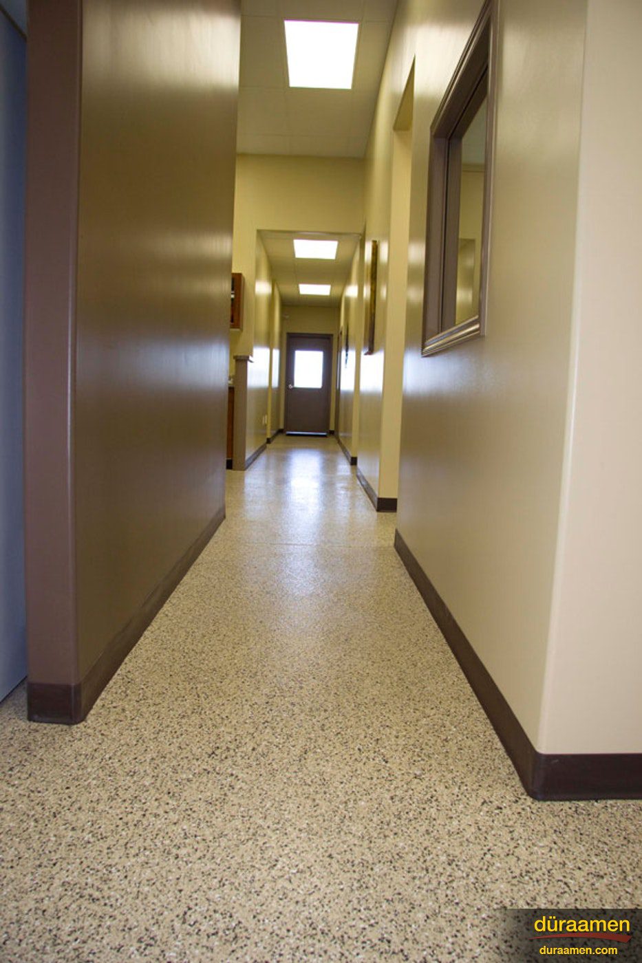 Hallways as well as animal holding cells and the ER utilize garage floor epoxy coatings in theis veterinary clinic Epoxy Resin based Vinyl Chips Flooring in Veterinary Clinic | Duraamen Engineered Products Inc