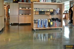 The metallic epoxy flooring enhances the product display as it's reflected of its surface.